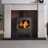 The Ashdale multi-fuel stove shown in a traditional stone fireplace in a living room.