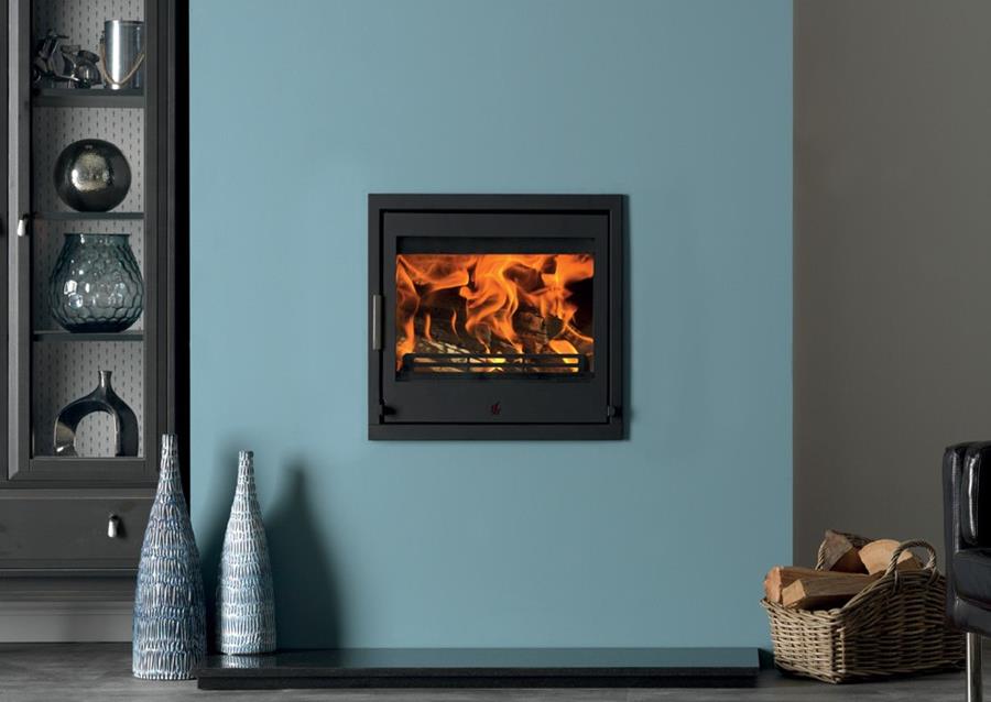 A Tenbury T550 multi fuel stove inset in a duck egg painted chimney breast.
