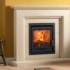 A Charlton & Jenrick Fireline FPi5W stove inset in a stone fireplace with yellow painted walls.