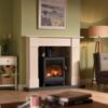 Burley Ashdown Woodburning Stove shown alight in a living room with green painted walls