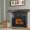 Burley Brampton Woodburning Stove shown alight in a living room with grey painted walls