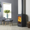 Burley Carlby Woodburning Stove shown alight in a living room with grey painted walls