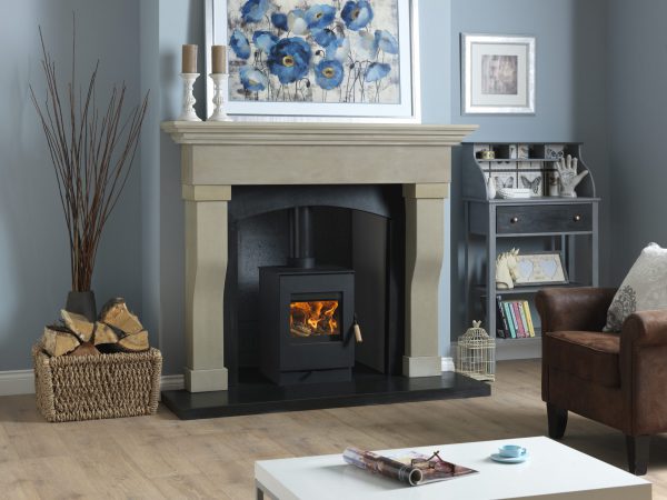 Burley Launde Woodburning Stove shown alight in a living room with grey painted walls