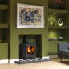Burley Stapleford Woodburning Stove shown alight in a living room with green painted walls