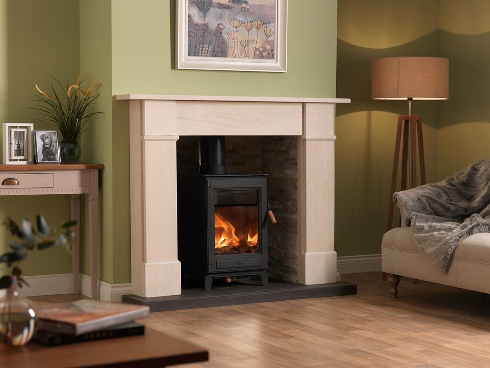Burley Thorncombe Woodburning Stove shown alight in a living room with green painted walls