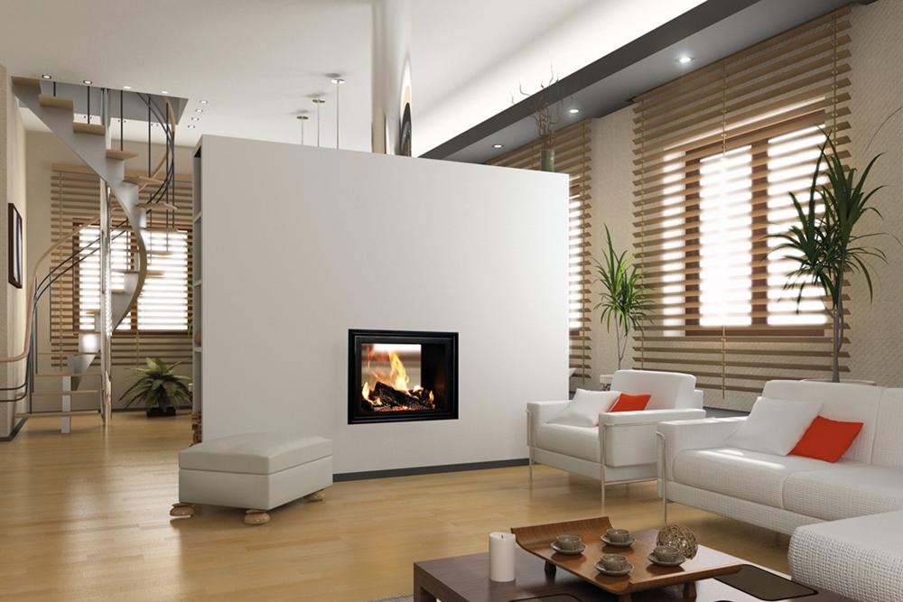 A woodburning stove which is set into a freestanding wall between two rooms so that the flames can be seen from both sides.